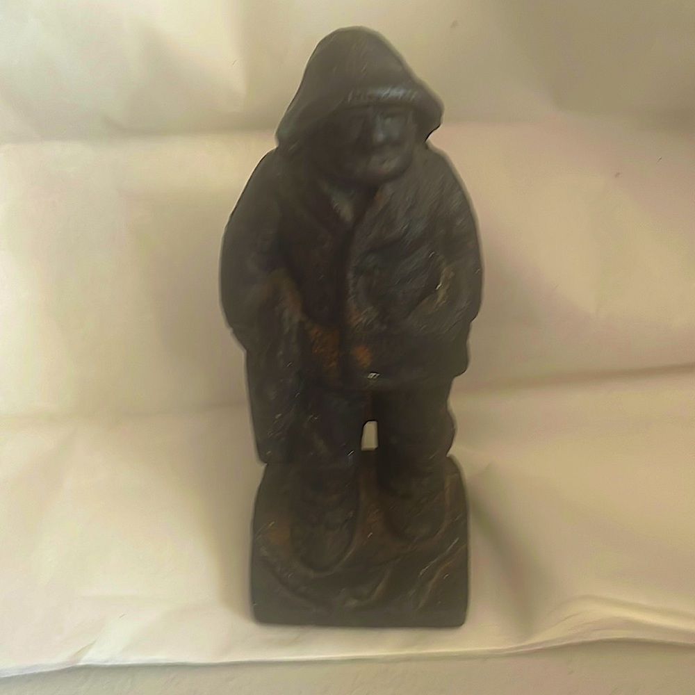 Solid cast iron fisherman door stop